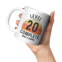 Load image into Gallery viewer, 20th_Anniversary_Mug_Level_20_Complete__11oz_White_LH_Model_Mockup.png
