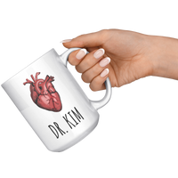 Load image into Gallery viewer, Cardiologist_Gift_Personalized_Cardiolo_15oz_White_RH_Model_Mockup.png
