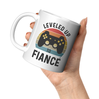 Load image into Gallery viewer, Fiance_Mug_Leveled_Up_to_Fianc_Gamer_11oz_White_LH_Model_Mockup.png
