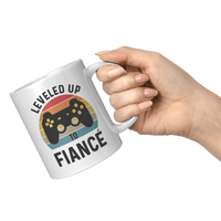 Load image into Gallery viewer, Fiance_Mug_Leveled_Up_to_Fianc_Gamer_11oz_White_RH_Model_Mockup.png
