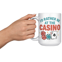 Load image into Gallery viewer, Id_Rather_Be_at_the_Casino_-_Coffee_Mug_15oz_White_LH_Model_Mockup.png