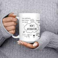 Load image into Gallery viewer, Moms_Affirmations_Mug_15ozWhiteMugLifestyleLHChest_Mockup.png
