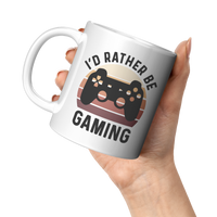 Load image into Gallery viewer, Personalized_Id_Rather_Be_Gaming_Coffee_11oz_White_LH_Model_Mockup.png
