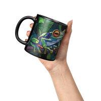 Load image into Gallery viewer, Stained_Glass_Frogs_on_a_Branch_Mug_Lifestyle_Raised_Hand_LH_Mockup.png
