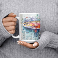 Load image into Gallery viewer, Watercolor_Trout_Mug_15ozWhiteMugLifestyleLHChest_Mockup.png