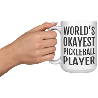 Load image into Gallery viewer, Worlds_Okayest_Pickleball_Player_Mug_15oz_White_LH_Model_Mockup.png
